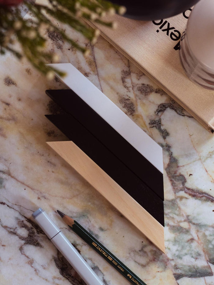 16" x 20" - Premium Wooden Picture Frame sample corner pieces in white, black, and natural wood finishes on marble table.