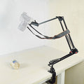 Adjustable Camera Holder for Overhead Photography: black, dark gray desk-mounted articulated camera holder/arm, functional in