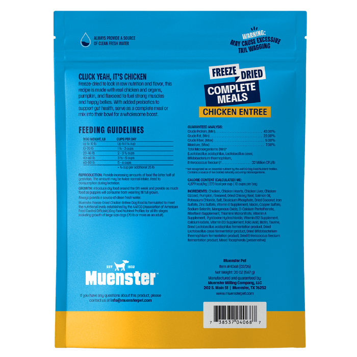 The back of a bright blue Muenster freeze-dried chicken dog food bag features feeding guidelines, ingredients, guaranteed analysis, and a barcode.