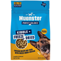 A bag of Muenster Perfect Balance Kibble + Freeze Dried chicken recipe dry food for dogs, featuring a blue and yellow package design with a German Shepherd on the front.