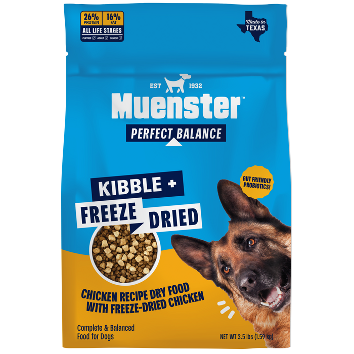 A bag of Muenster Perfect Balance Kibble + Freeze Dried chicken recipe dry food for dogs, featuring a blue and yellow package design with a German Shepherd on the front.