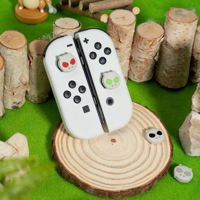 "Skull Monster" Switch OLED Joystick Caps: off-white, black cat-like cartoon characters, kawaii cartoon style