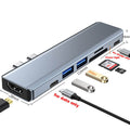 Versatile Docking Station with Multiple Features: silver-gray, black multiport USB hub/docking adapter, minimal tech accessor