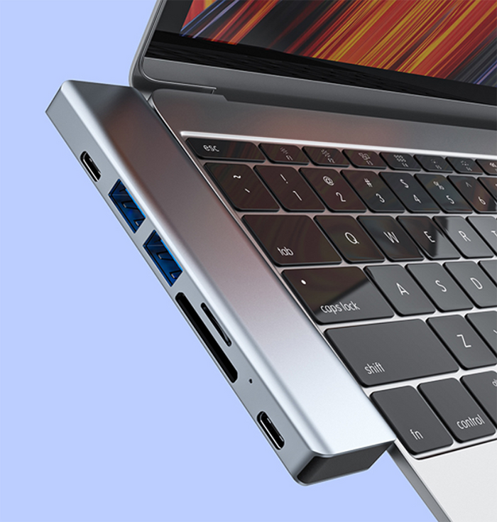 Versatile Docking Station with Multiple Features: silver-gray, black multiport USB hub/docking adapter, minimal tech accessor