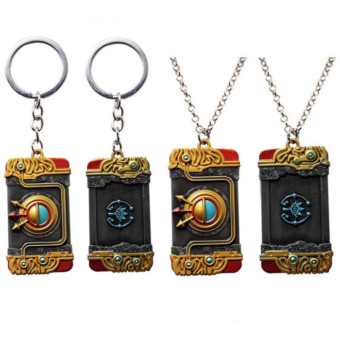 Zelda Purah Pad Keychain, Adventure Symbol: gold, black ornate book-themed design, fantasy, ornate style